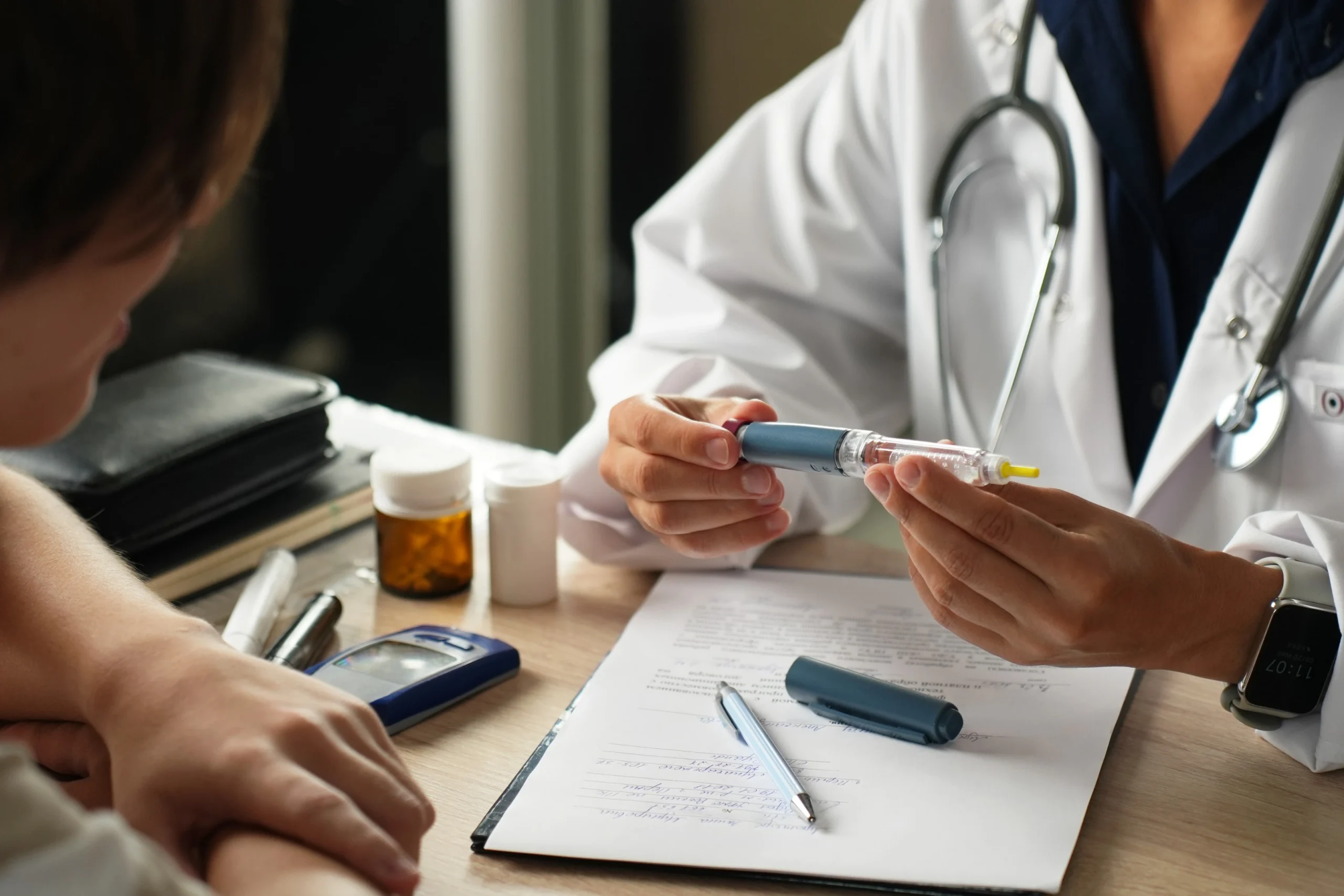 Doctor explaining injectable weight loss medication options to patient at Enhanced Wellness