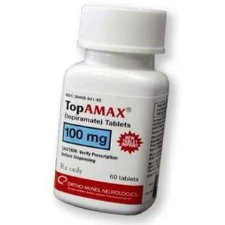 Bottle of Topamax 100 mg tablets shown for Enhanced Wellness in Derby Kansas. The white prescription bottle has a red label with dosage and branding visible.